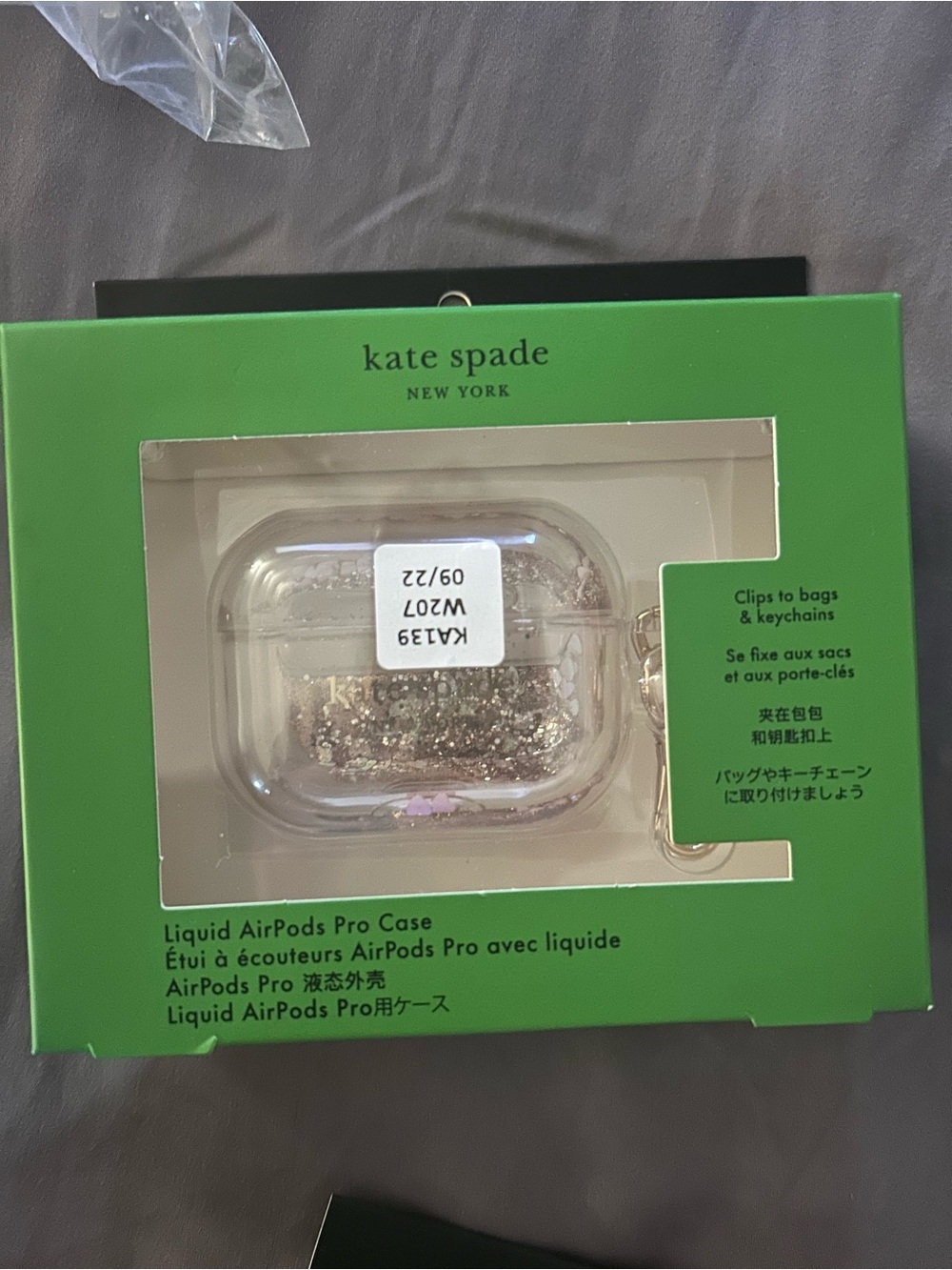 kate spade clear AirPods Pro case with gold glitter and pink accents
